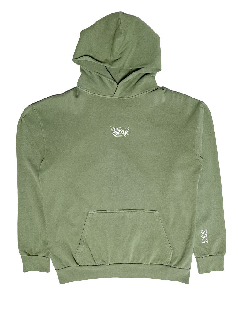 a green hoodie with the word STAY written on it